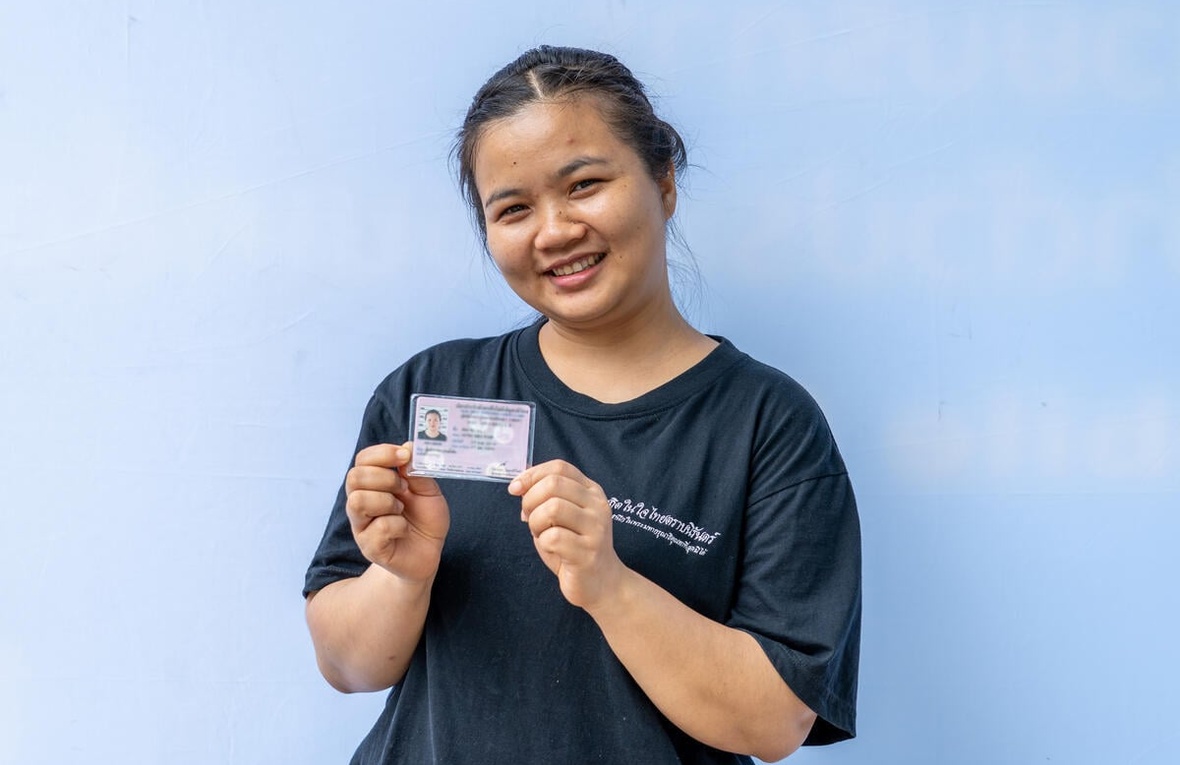 Naw Aung Shaw Paw, a refugee from Myanmar living in Ratchaburi, Thailand, displays her new government-issued identity card.