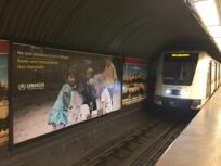 Posters Urge Passengers and Passersby to Remember Refugees