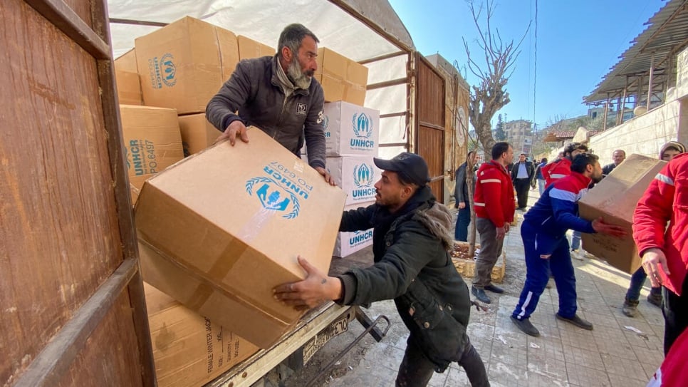 Relief items including high-thermal blankets and kitchen sets are unloaded for distribution in Aleppo_UNHCRHameed Maarouf