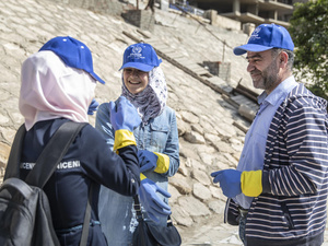 Egypt. Refugees and locals clean the Nile together