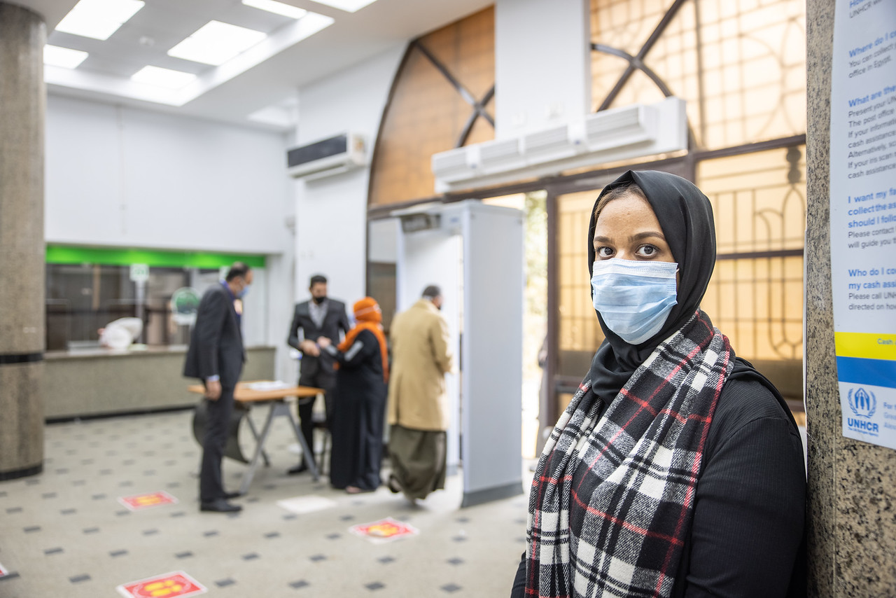 Like thousands of refugees and asylum-seekers, Faiza receives her cash assistance from the Egypt Post Office.