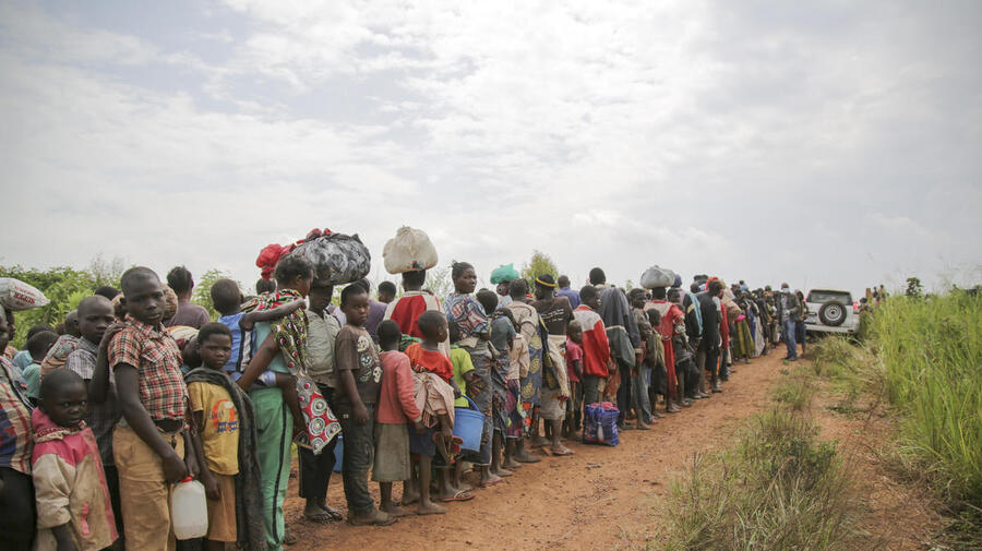Congolese asylum-seekers await health screening in Zombo, near the border between Uganda and the Democratic Republic of Congo in July 2020.