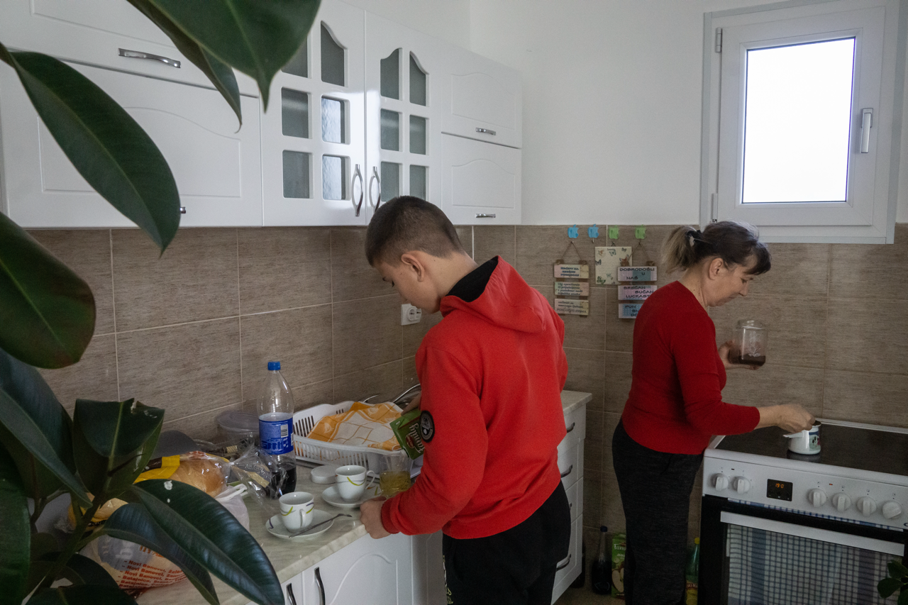 Ljubinka, right, from Croatia and her son David prepare lunch in their new house, provided by the Regional Housing Programme.