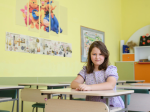 Sofia, a 9 year old girl from Ukraine, sits in an empty classroom. She arrived in Bulgaria with her family on 1 March 2022 from Kyiv.