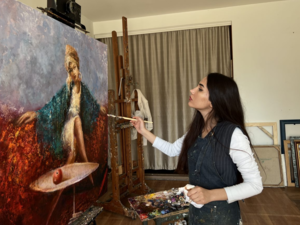 Hadiya works in the studio in Baku. 