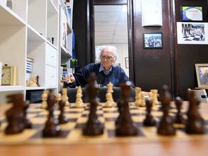Man plays chess