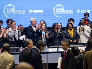 A group of people at the front of a conference centre