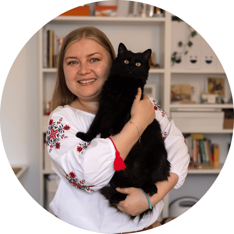 A Ukrainian woman poses with her cat