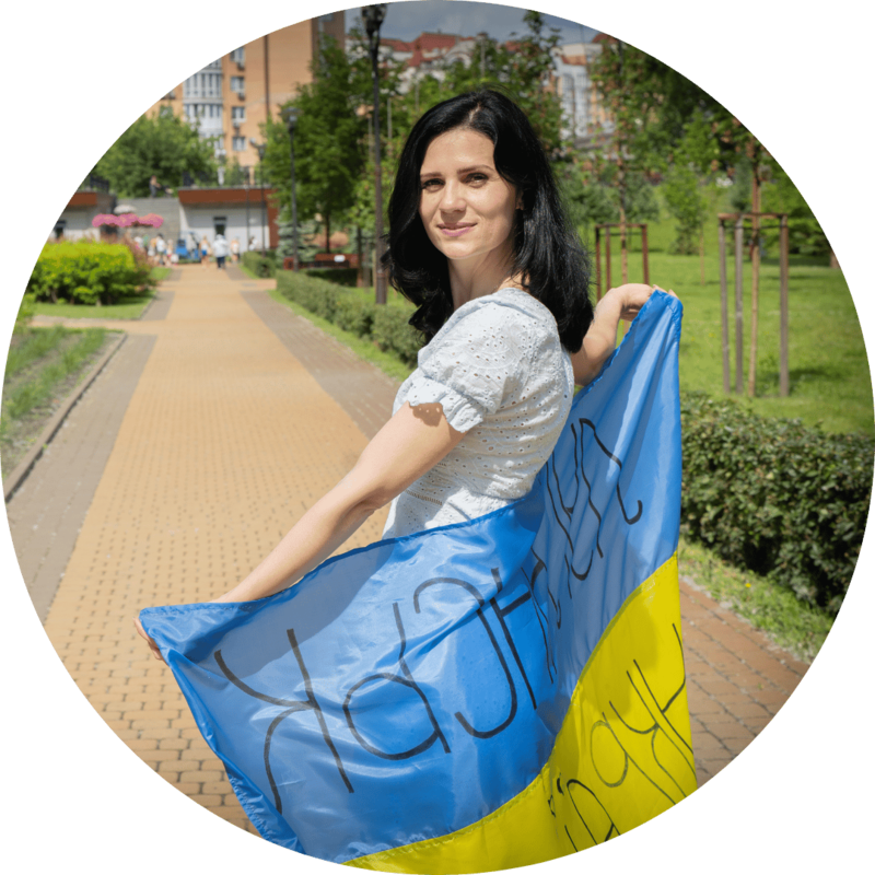 A woman in Ukraine posing with a flag