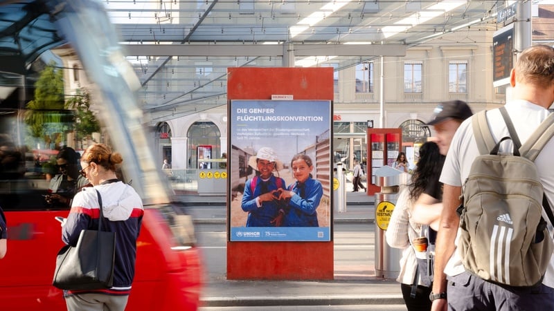 A poster at a tram stop in Switzerland