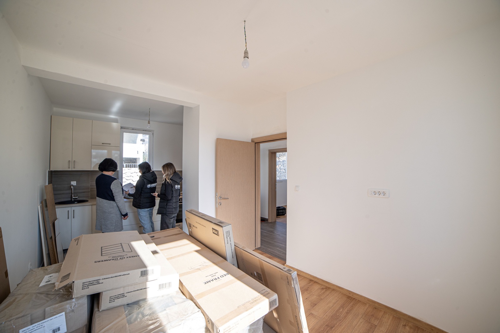 Senka is at her house, provided by the Regional Housing Programme, while explaining her plans for interior design to UNHCR staff.