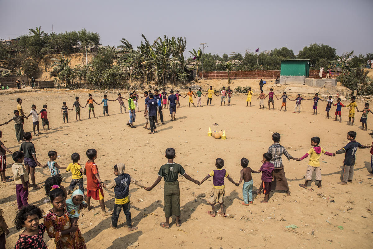 Children get ready to play football in Camp 2 East section of Kutupalong.