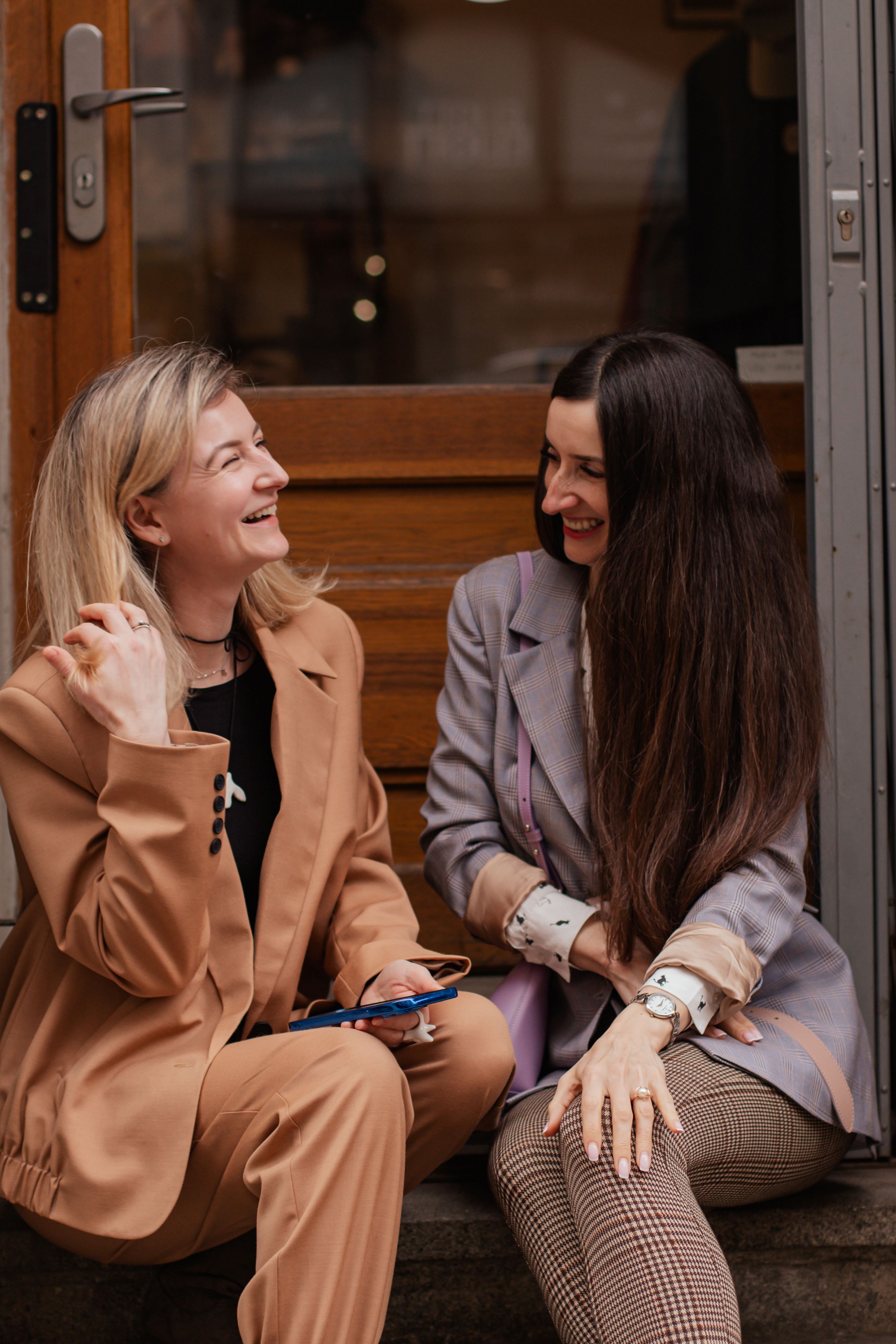 Maria (left) fled Kharkiv in February 2022 and now runs a clothing store in Pilsen, Czech Republic. Maria offered her support to fellow Ukrainians in the center where Tetiana works.
