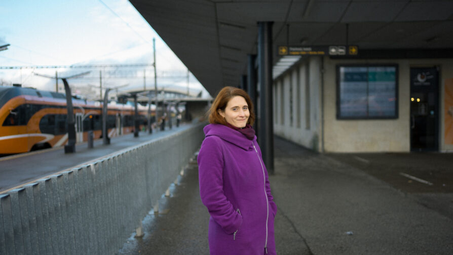 A person in a purple coat