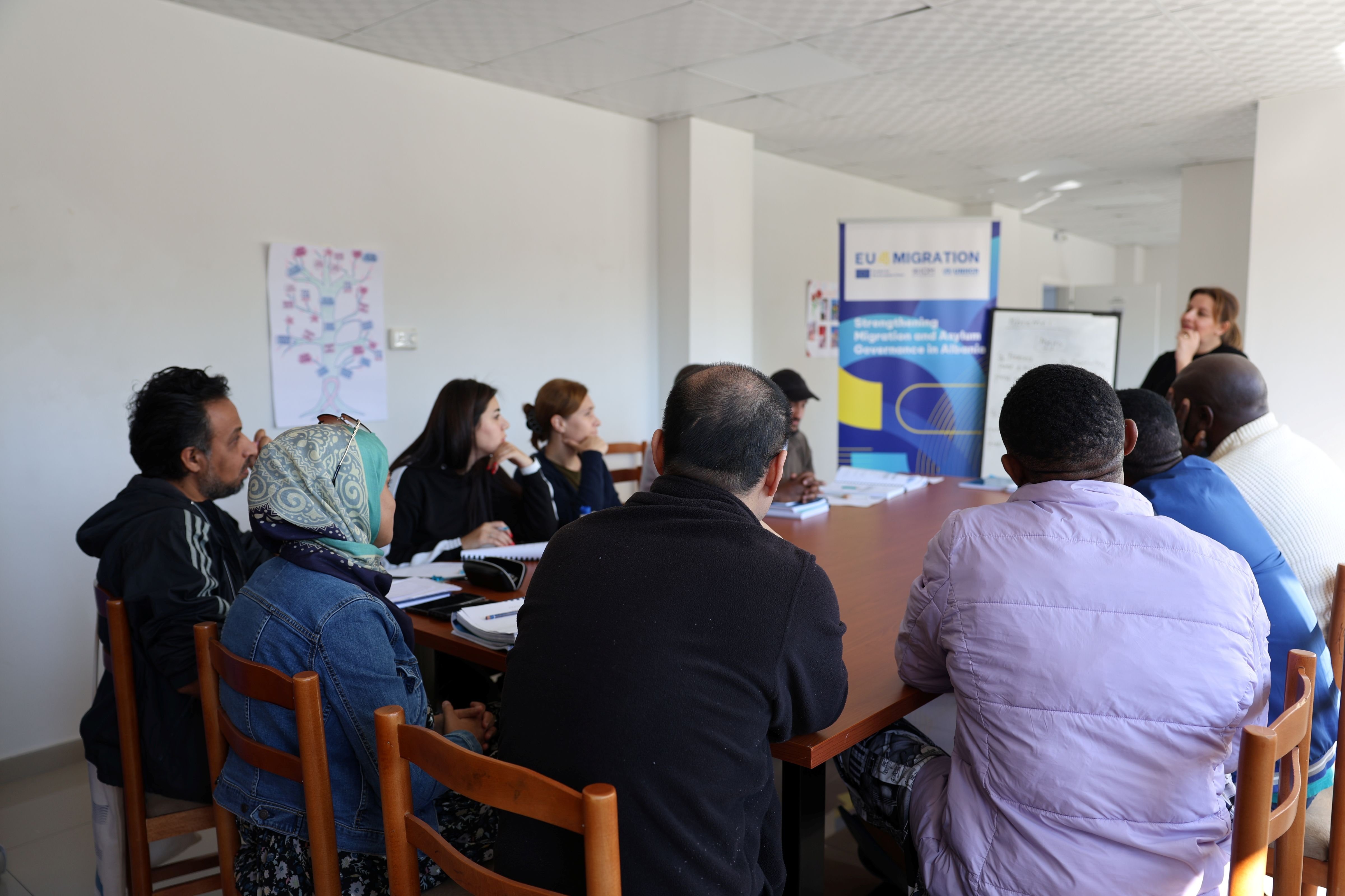 A mix of new and continuing students take part in an introductory round during an Albanian language class at the National Reception Centre for Asylum in Tirana, led by teacher Jorida Pina. 