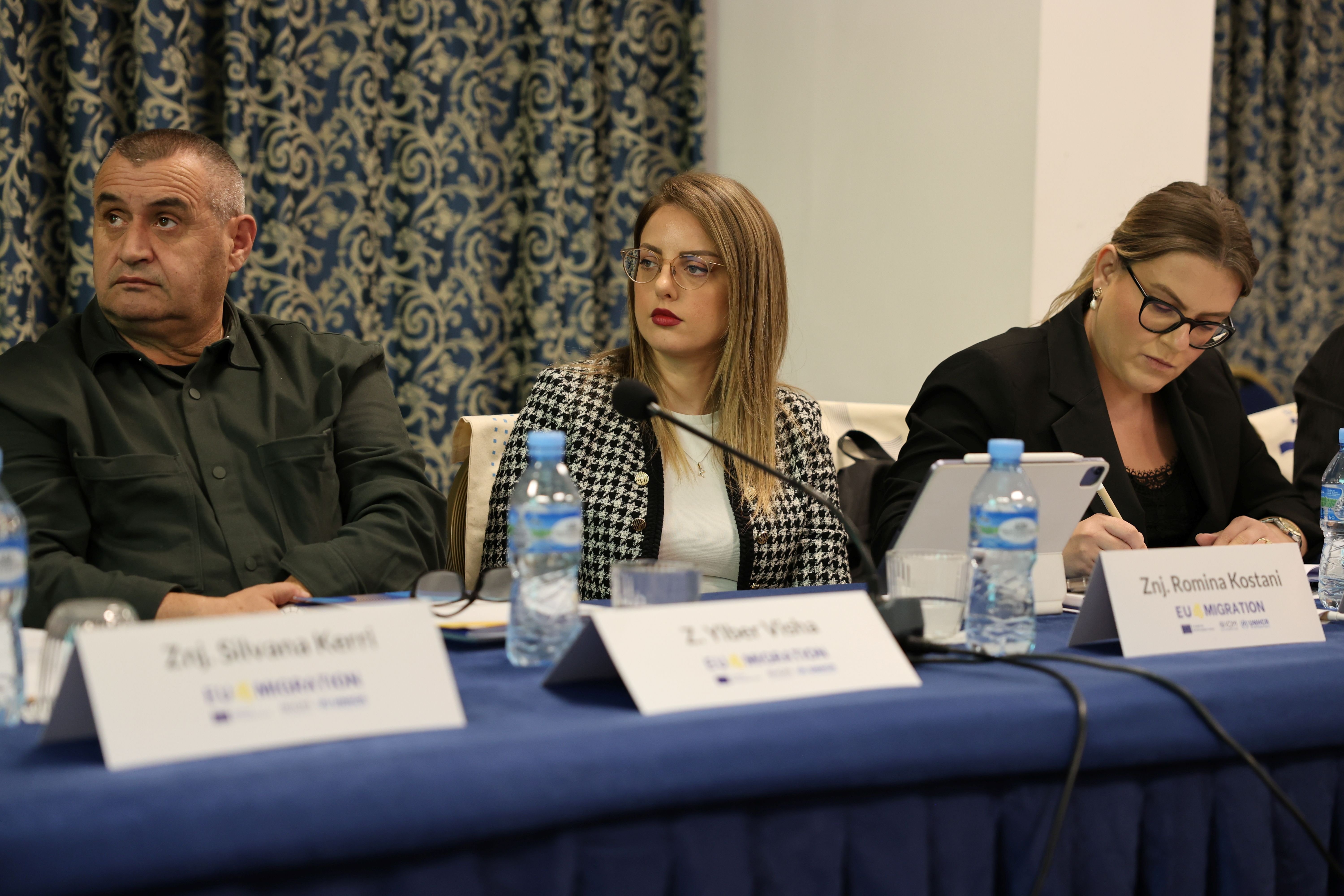 Participants from national institutions exchange views during the Tirana roundtable on enhancing access to documentation for refugees and others under international protection. 