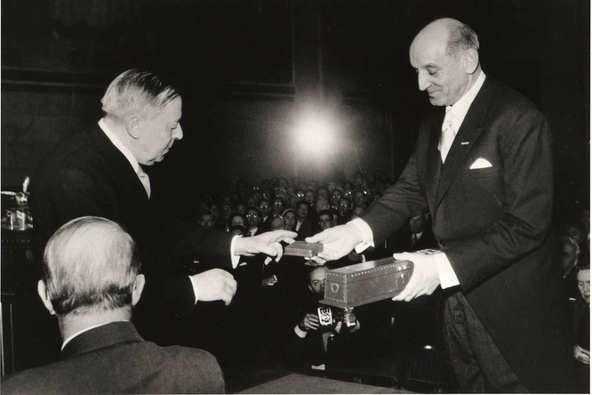 Mr. Gunnar Jahn, Chairman of the Norwegian Nobel Committee, hands the Nobel Peace prize to to the United Nations High Commissioner.