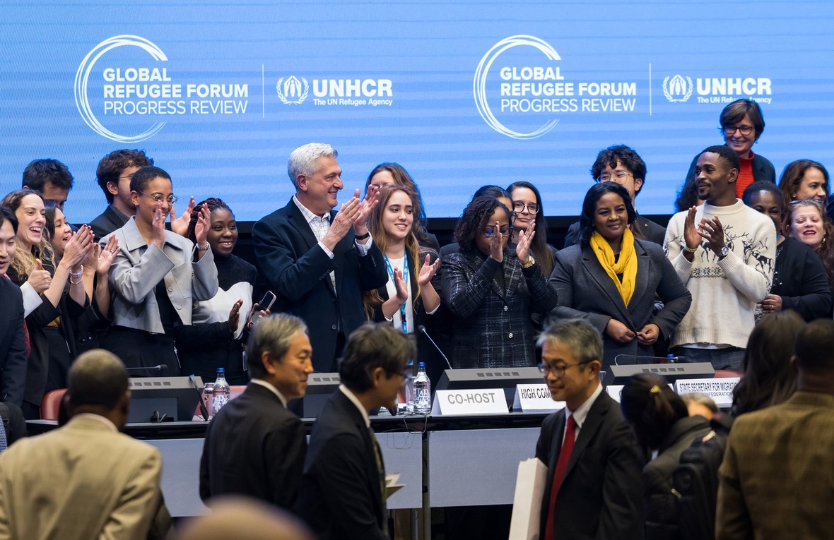 A group of people at the front of a conference centre