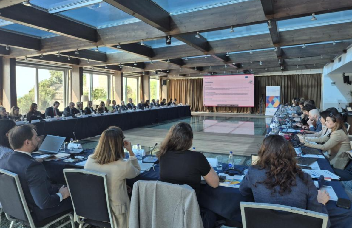 A conference room with people seated