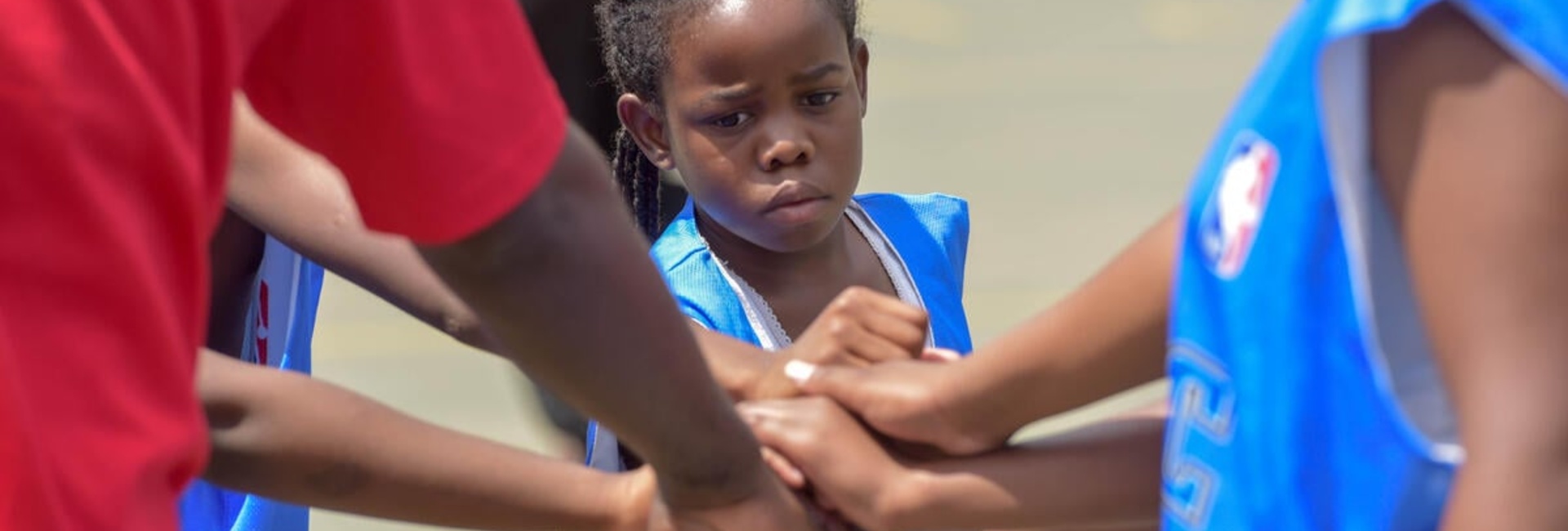 Young girl plays basketball