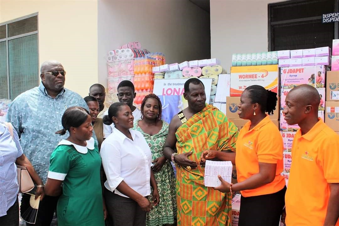 Ms. Harriet N. Asante presenting items to staff at the health facility