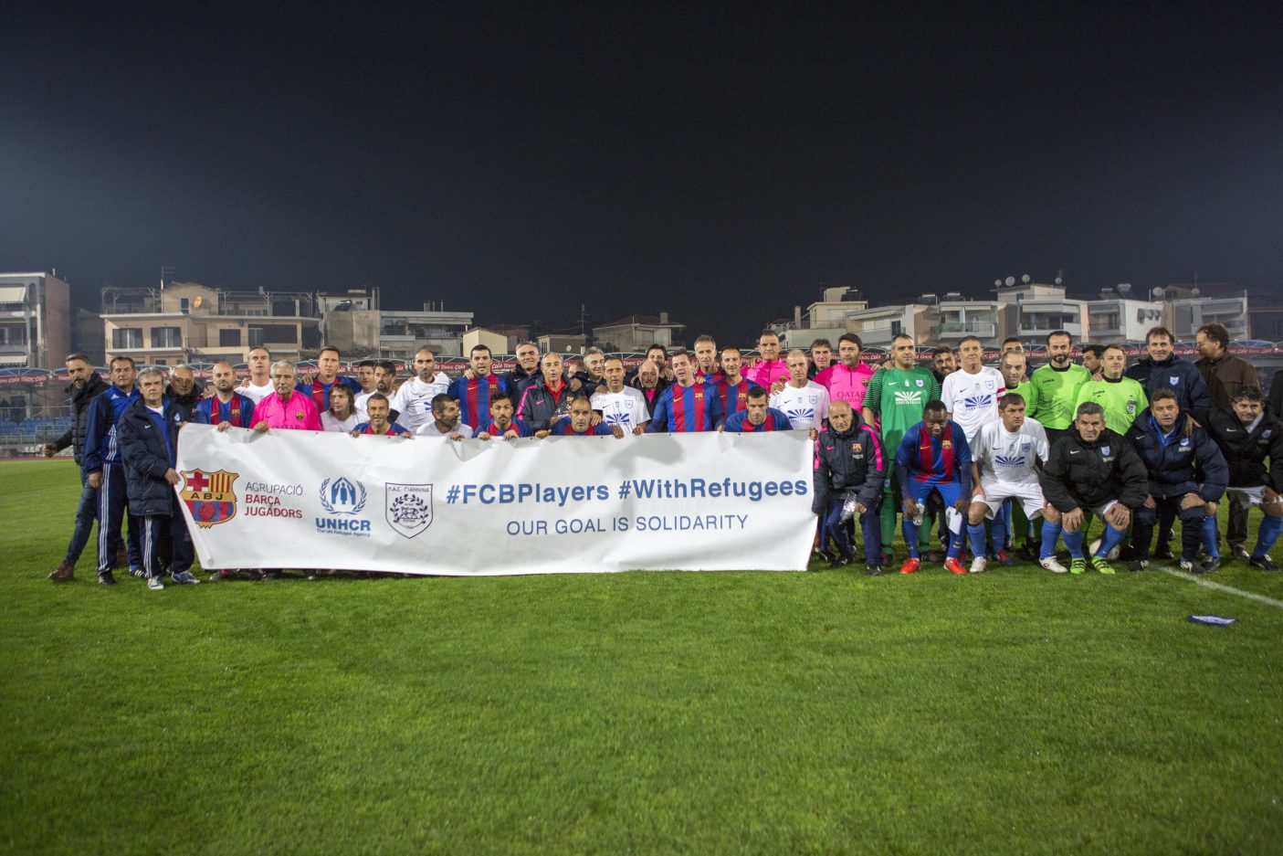 A group of football players posing for a photo