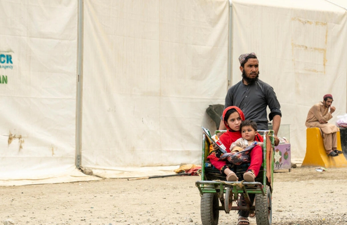 Hadigul is carrying his younger sisters