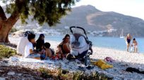 Greek islanders open their hearts and businesses to refugees