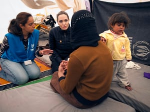 UNHCR Special Envoy Angelina Jolie meets with refugees at the Za'atri refugee camp in Jordan.