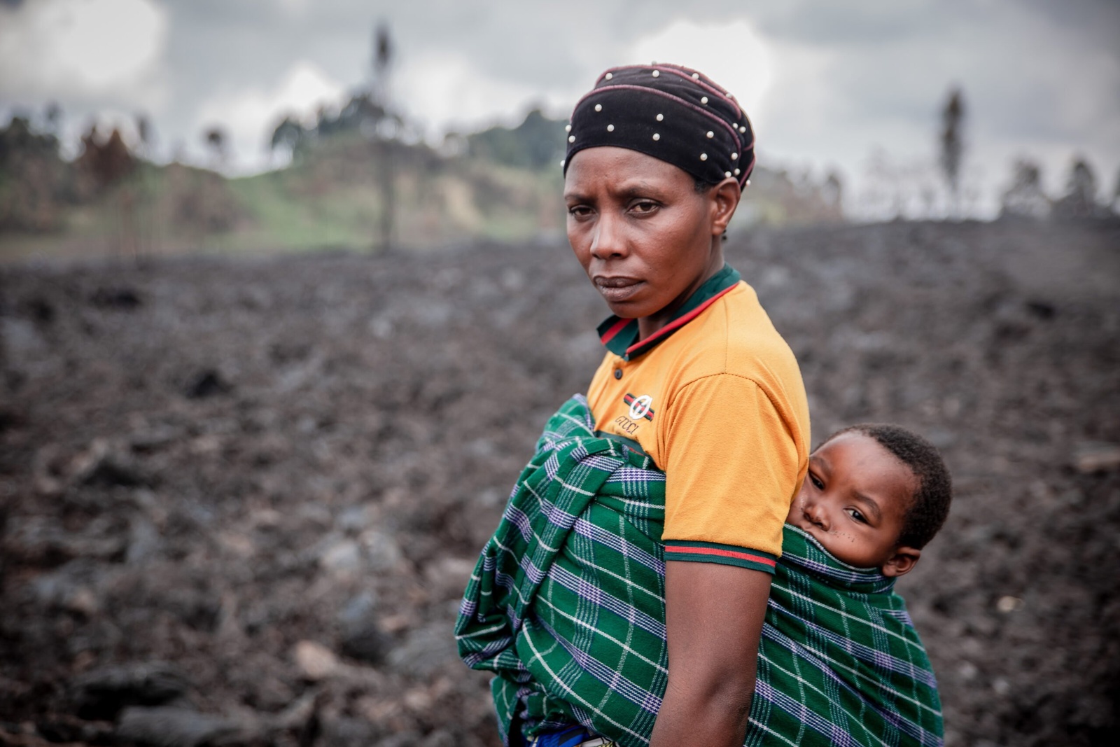 Esperance Muhoza (40) visits the spot where their house once stood. © UNHCR/Guerchom Ndebo
