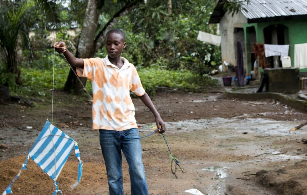 Liberia. Solomon plays with a kite