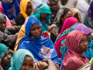 Sudanese refugees gather outside