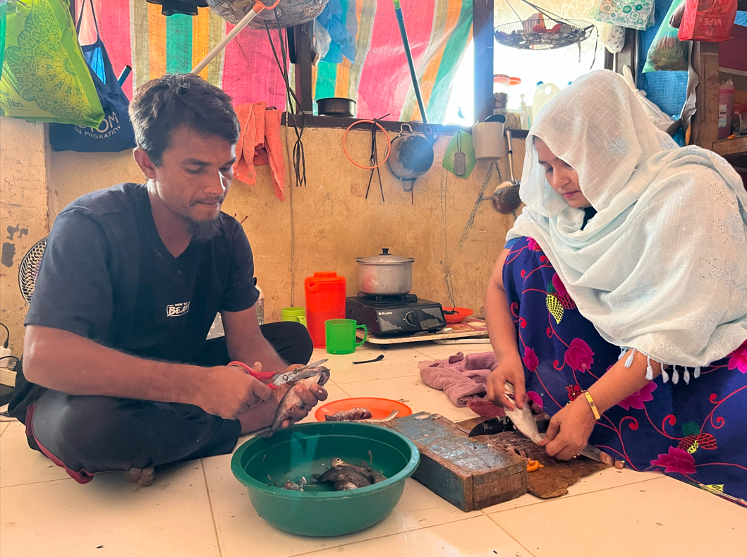 Man and woman cooking together