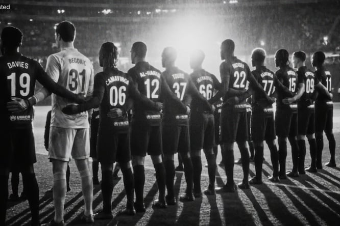 AI-assisted rearview image of a football team lined up on the pitch inside a brightly lit stadium 