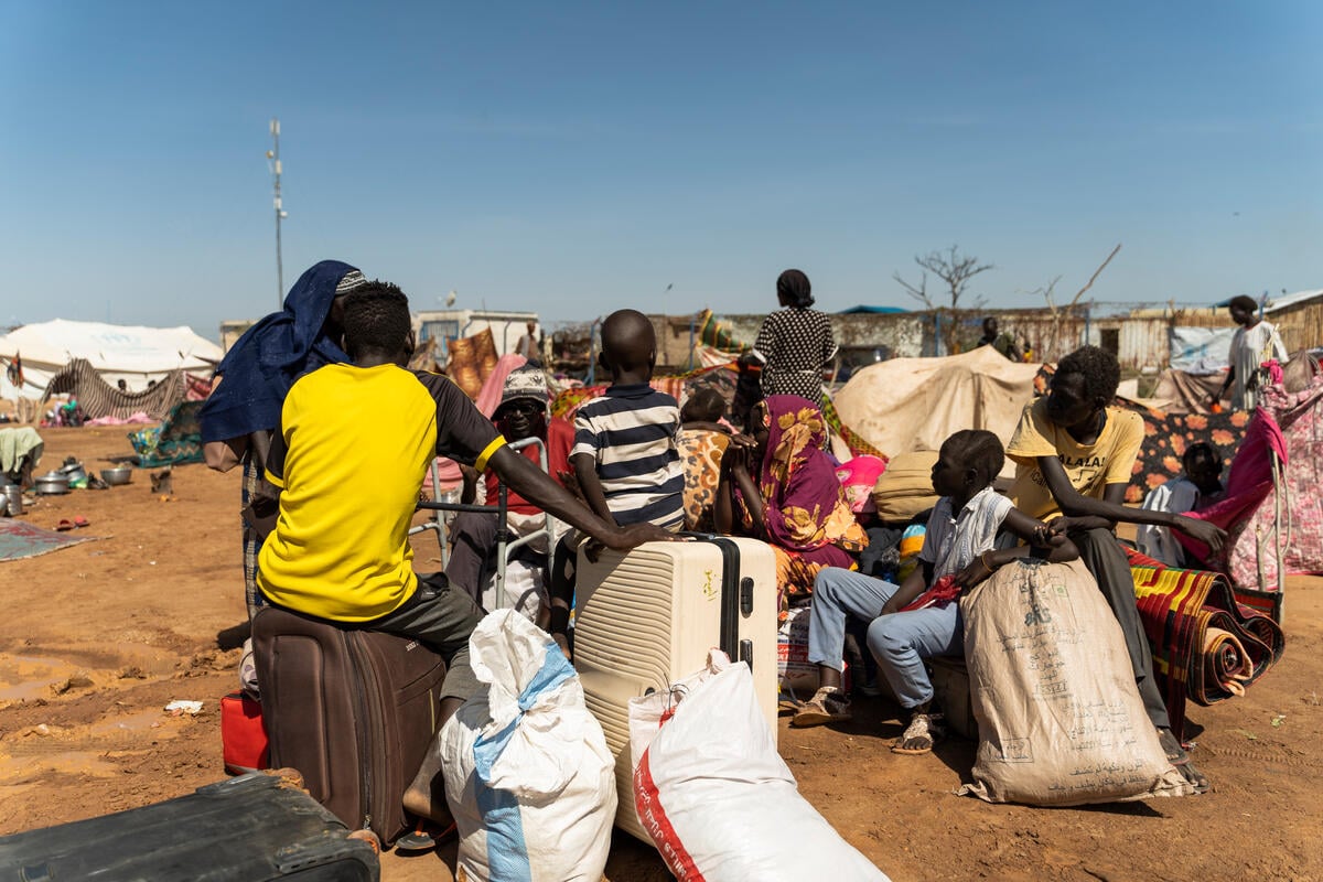 Refugees from Sudan wait at the Joda border point in South Sudan's Upper Nile State for transportation to the transit centre in Renk.