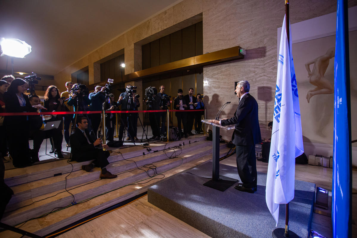 Filippo Grandi, High Commissioner for Refugees, speaks to a group of journalists and photographers.