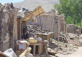 A returnee from Kabul runs one of the few opened shops in Estalef village in the Shomali Plain.