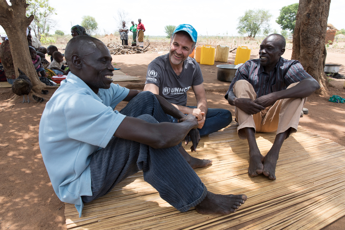 Uganda. UNHCR Goodwill Ambassador Khaled Hosseini with Yahaya and Mike at Bidibidi settlement