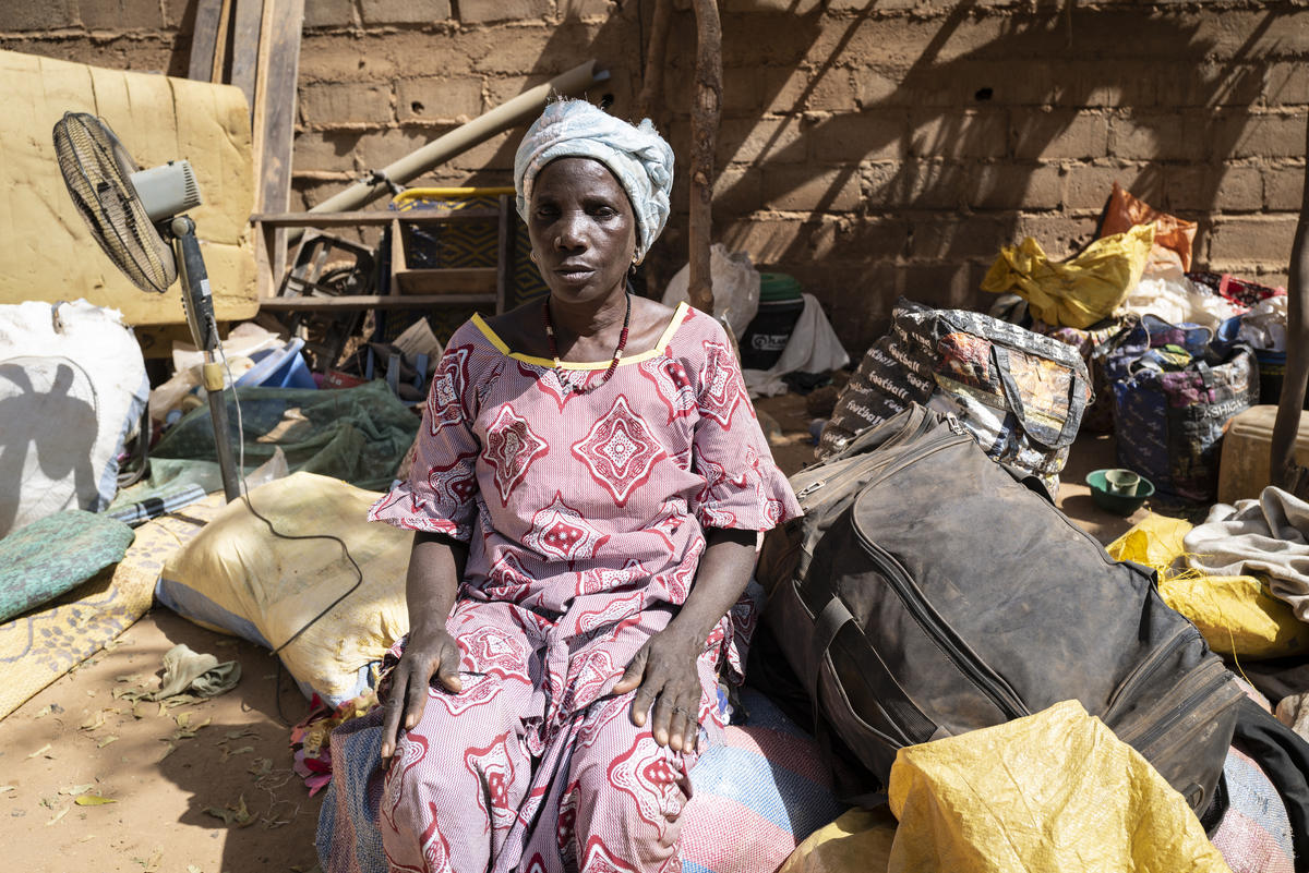 An internally displaced Burkinabe woman sits among belongings in Kaya, Burkina Faso, February 2020.