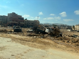 Wrecked cars lie in an area of wasteland after deadly floods in the Libyan city of Derna.