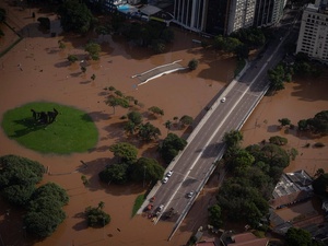Aerial view of a flooded road bridge and park