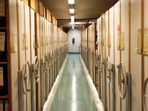 A view along a corridor of rolling stack archive shelves