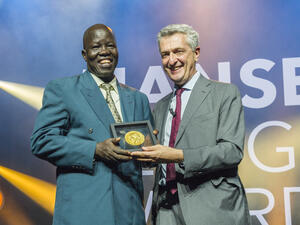 UN High Commissioner for Refugees, Filippo Grandi, presents the 2018 Nansen Refugee Award to Dr. Evan Atar Adaha, a surgeon and medical director at a hospital in north-eastern South Sudan.