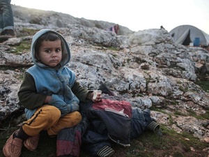 Syria. Young displaced boy fleeing violence near Idlib