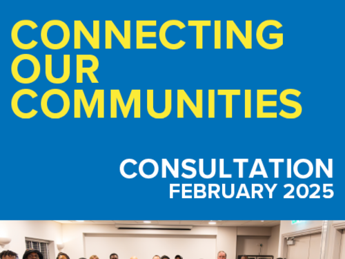 A blue and white cover with a group of people in an office room smiling.