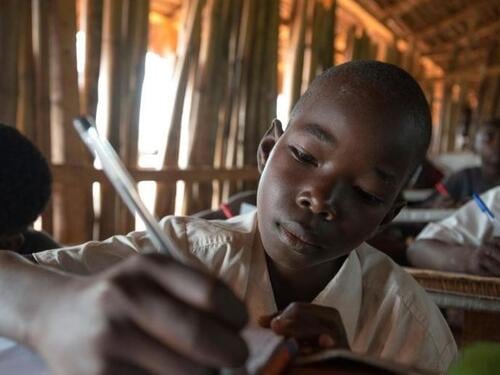 Kenya. Students using tablets in Nasib secondary school