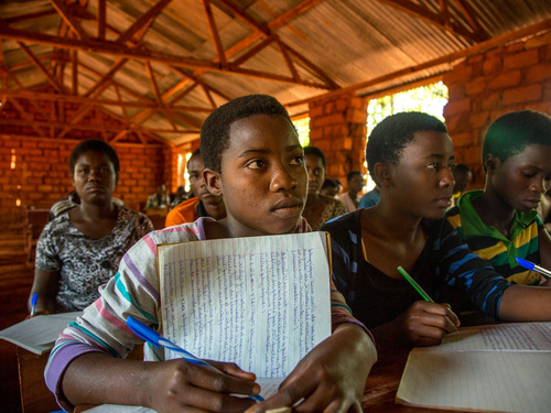 Tanzania. Refugee children battle the elements to learn