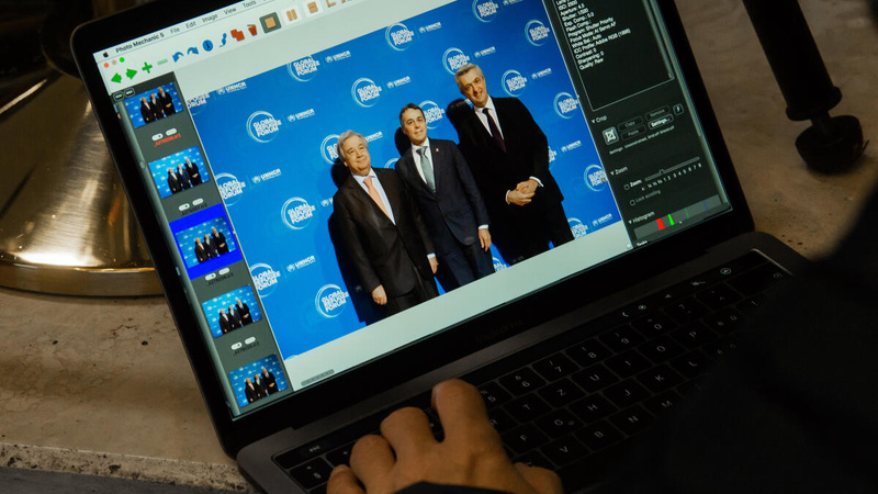 A computer screen showing a series of photos of delegates arriving at the 2019 Global Refugee Forum. 
