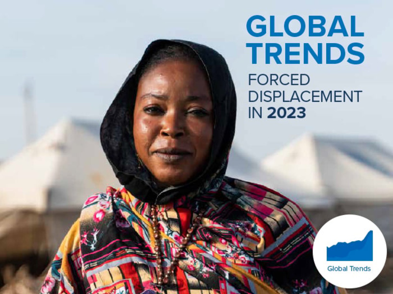 Cover of the Global Trends 2023 report featuring a woman in an IDP camp.