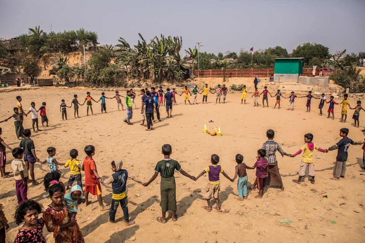 Children get ready to play football in Camp 2 East section of Kutupalong.